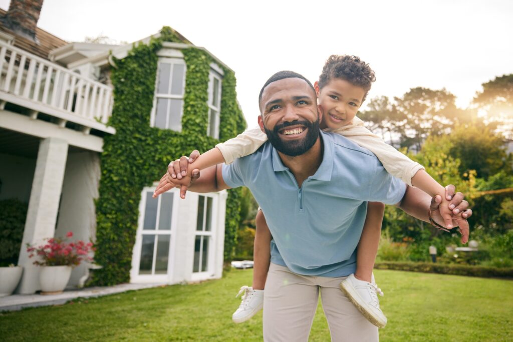 Father, child and piggyback outdoor or garden for real estate happiness, celebration and game at ne